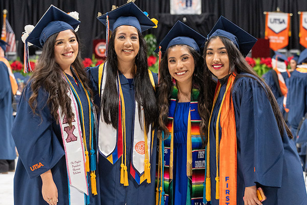 Group of graduates wearing a variety of different stoles and cords