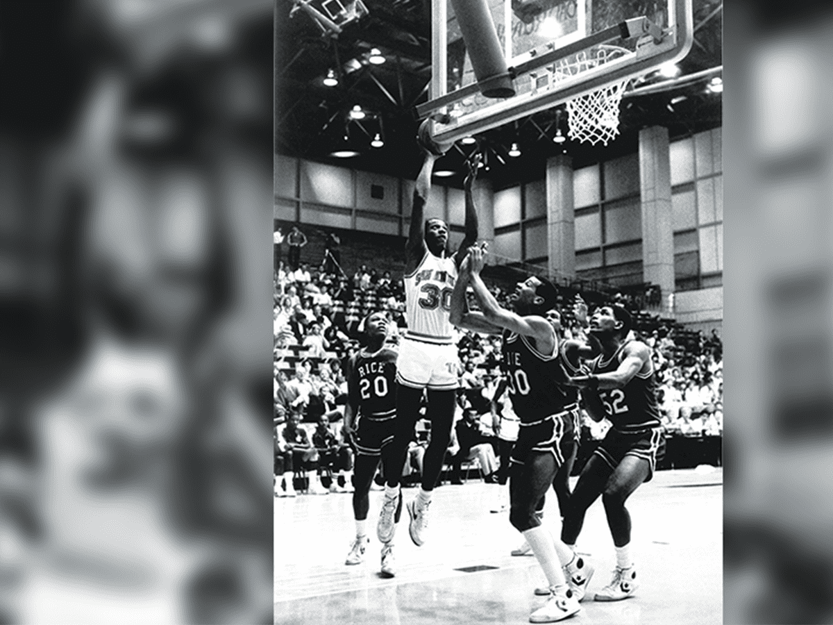 Gervin shoots a scoring hoop in a game against Rice on December 10, 1984, in his junior year. An All-America candidate that season, he was the nation’s ninth leading scorer.