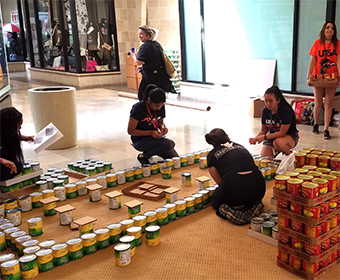 Architecture students develop model of San Antonio Central Library Building from canned foods