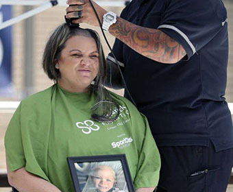 Honors College students encourage Roadrunners to go bald for children with cancer