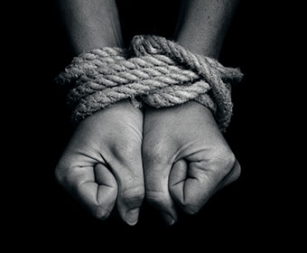 stock photo of hands tied with rope