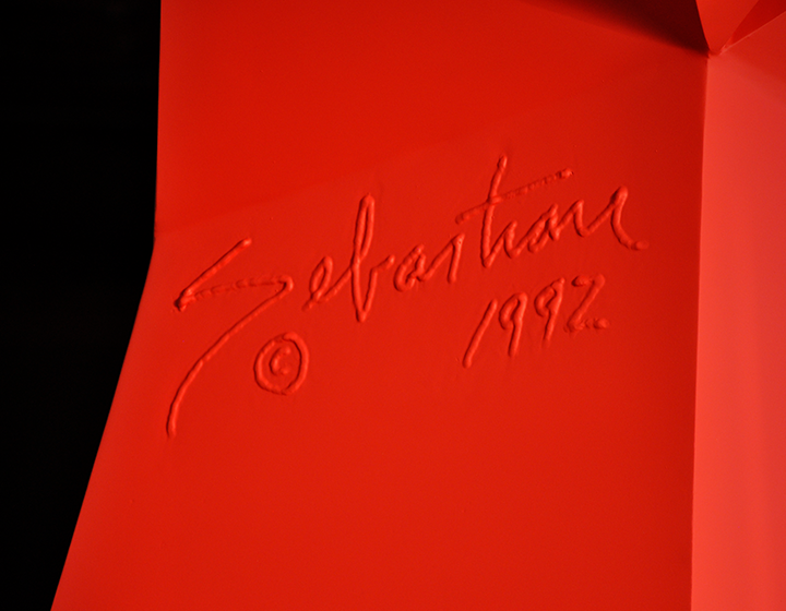 A closeup of Sebastian’s signature that’s been forged into his work