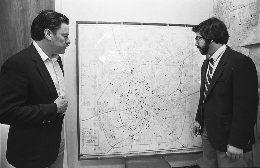 Voting rights advocates Willie Velasquez and Andy Hernandez display a map of Mexican American voter polling in San Antonio