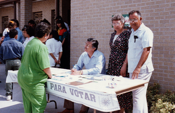 Southwest Voter Registration Education Project volunteers help community members in Laredo register to vote