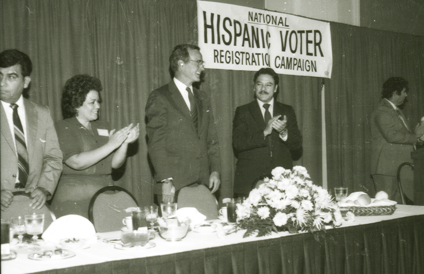 Presidential candidate George H.W. Bush attends a Hispanic voter registration campaign event with Willie Velasquez