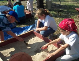 students using sand tray