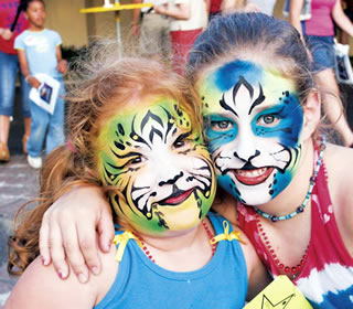 girls in face paint at Texas Folklife Festival