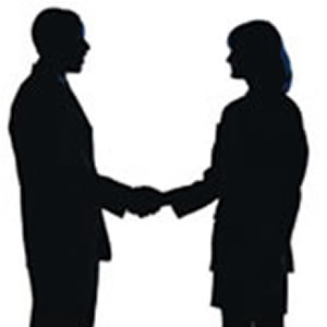silhouette of people shaking hands
