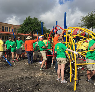 Volunteers build playground