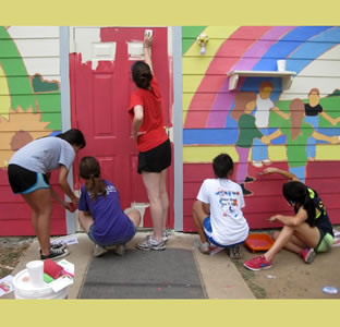 students paint mural