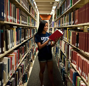 student in library