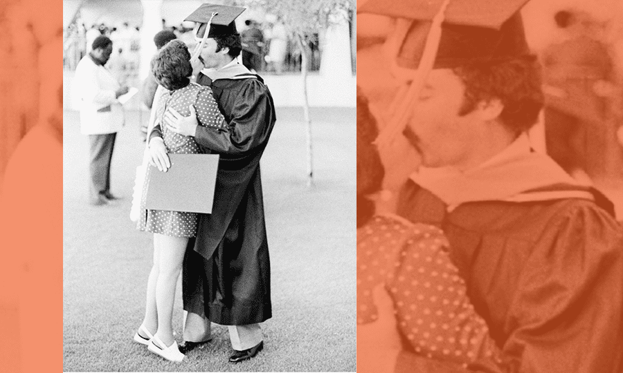 New graduate Jesse Kent Jr. gets a congratulatory kiss from his wife.