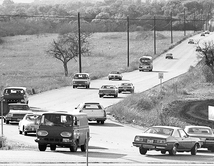 Traffic on UTSA Boulevard, the main artery to campus, on February 18, 1976.