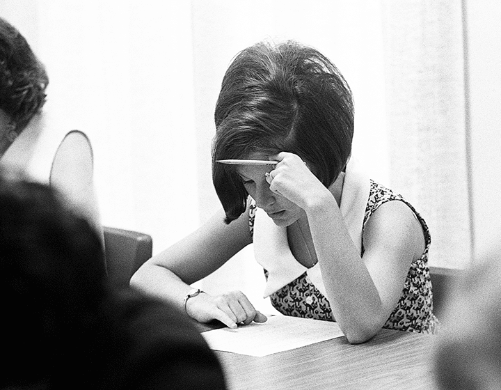 Peggy Jo Tholen, UTSA’s first student, cracks into her education class final.