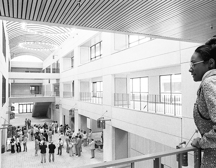 Admissions counselor Gloria Dansby scans the main <em>galleria</em> of the new Humanities-Business Building.