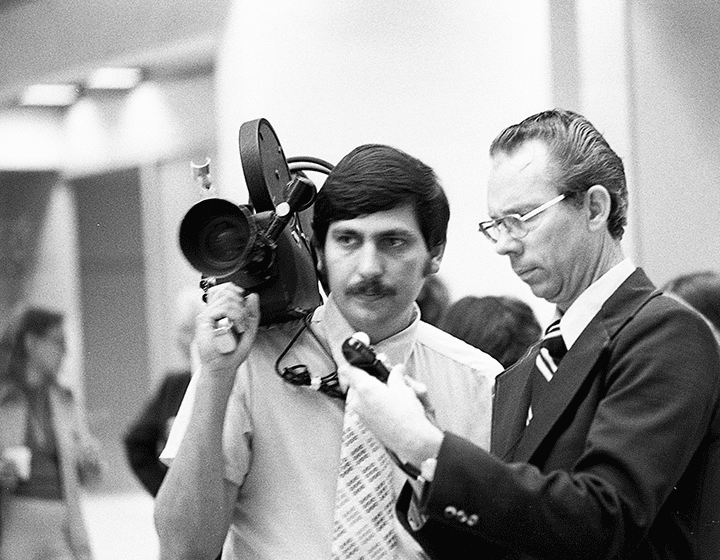 WOAI-4’s Ed Barrera and Paul Schaefer prepare to film for their upcoming newscast.