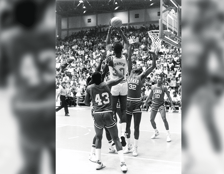 Gervin launches for a shot in play against Lamar University.
