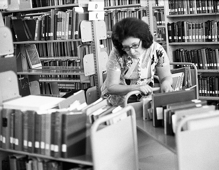 Sorting books for shelving in the library.