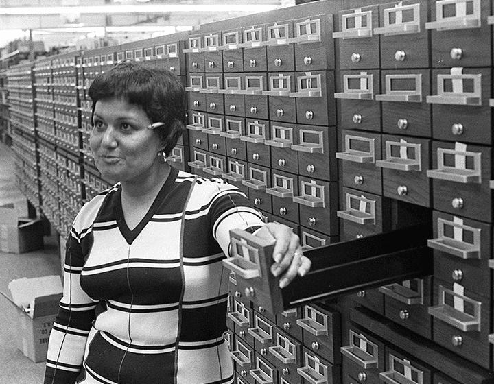 Library worker Leslie Villareal works at the card catalog to get reference cards filed.