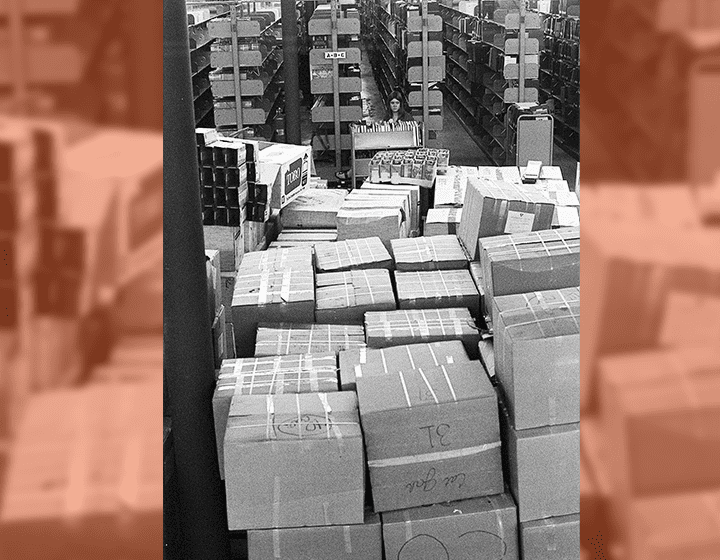 Cartons of books in the tens of thousands begin to arrive at UTSA’s new campus, where they will be initially housed in the gym of the Physical Education Building.