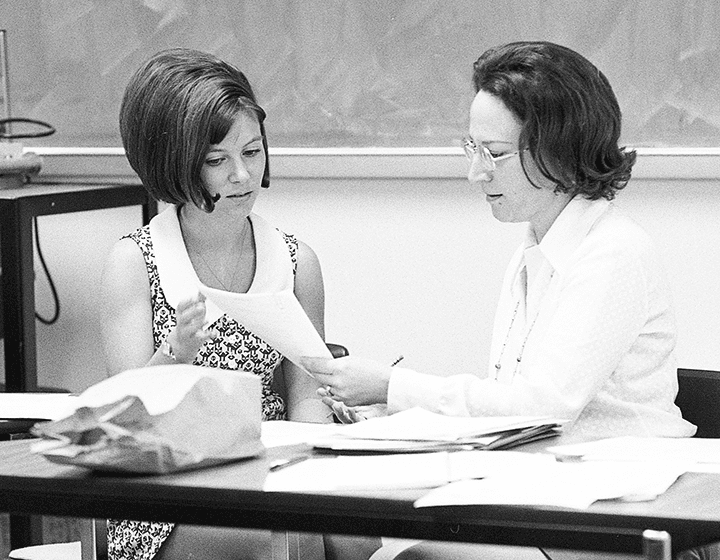 Tholen discusses her exam with education professor Mary Beth Penny on UTSA’s very first day of finals, July 16, 1973.