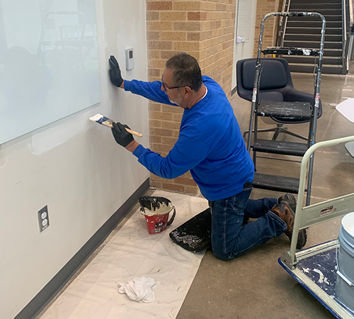 Facilities team painting the SEB