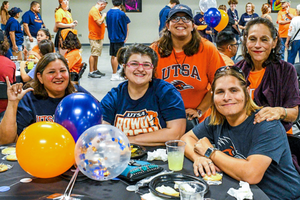 Roadrunner family members sitting around a table