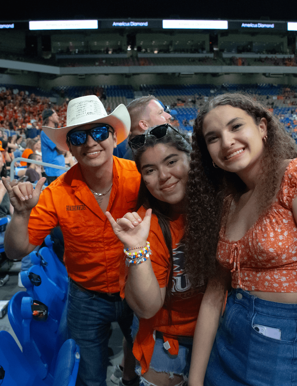 Students showing school spirit at a football game.
