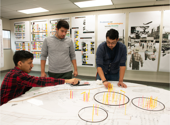 Students gathered around a table working together