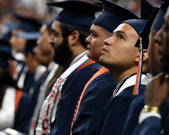 Students lined up in cap and gown