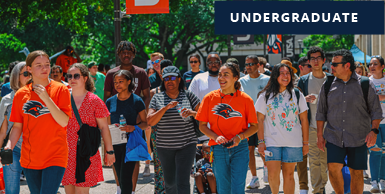 Students walking campus in a group