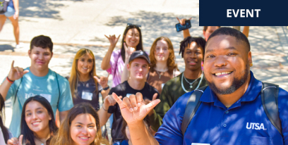 UTSA campus guide taking a selfie with potential students