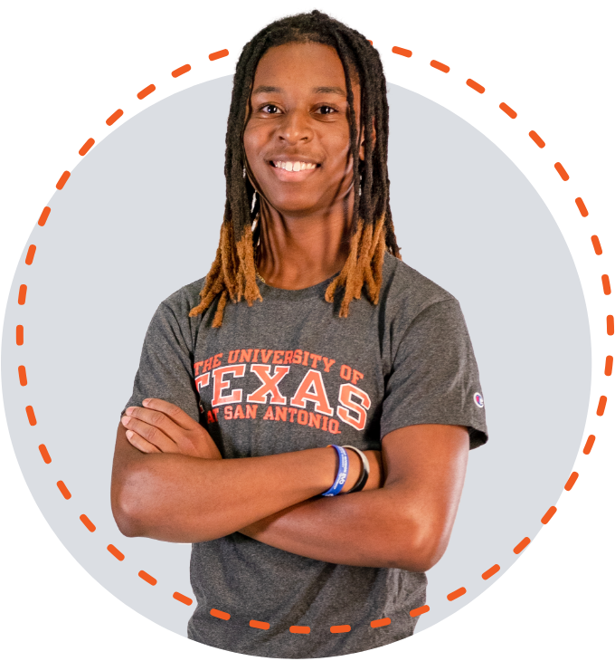 Malachi Plumer smiling big with his arms crossed in front of him wearing a grey UTSA t-shirt