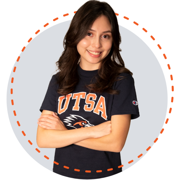 Beverly Quintana smiling big with her arms crossed in front of her wearing a blue UTSA t-shirt