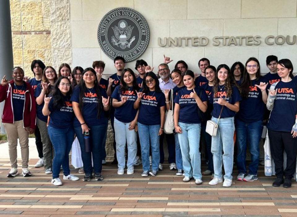 Instructor showing students how to dust items for fingerprints