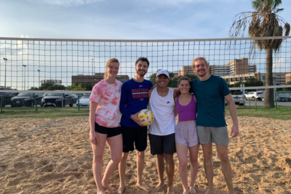 Health Science Center Students posing for a photo on the beach