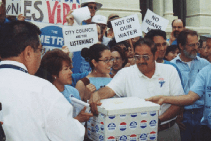 People gathered around a voting box