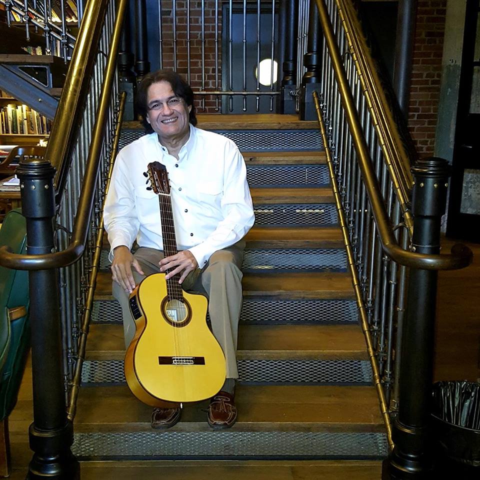 George Gaytan posing with guitar