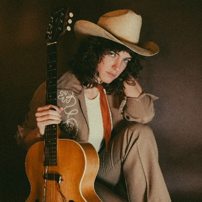 Georgia Parker posing with guitar