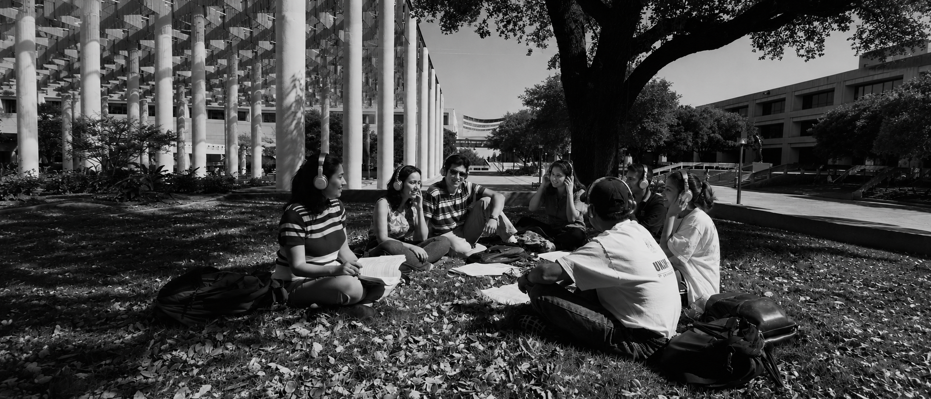 70's photo of Students holding button that states join UTSA alumni association