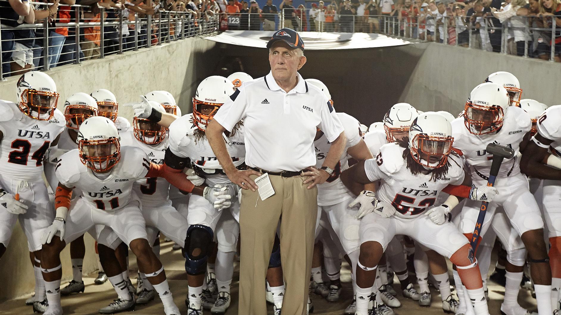 Larry Coker walking on to field with UTSA football team