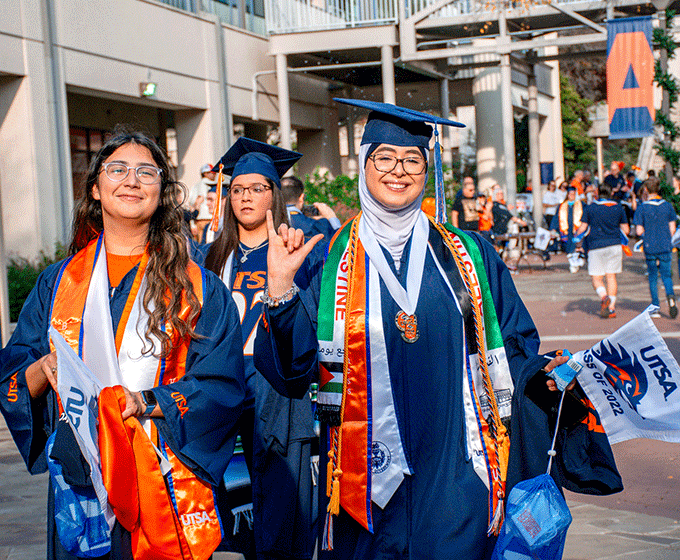 UTSA graduates walking on campus