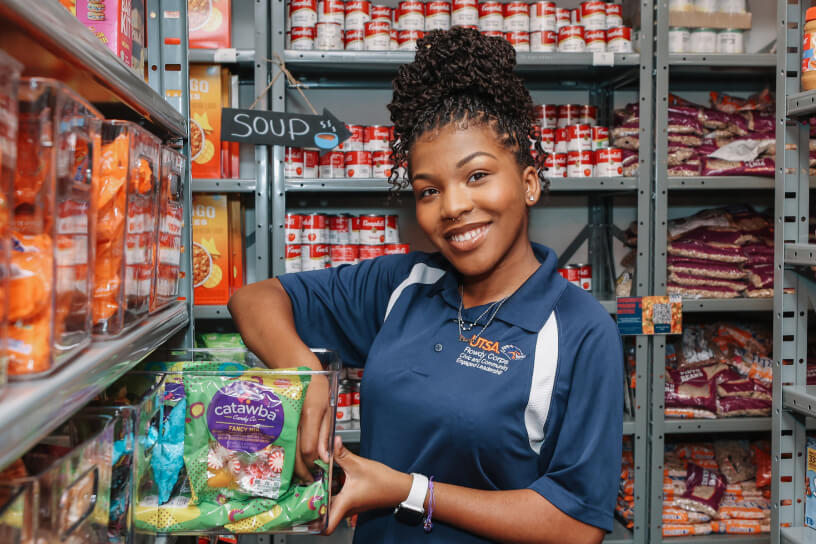 Black female inside the UTSA Food Pantry