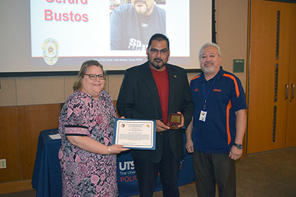 Picture of Mr. Bustos receiving award