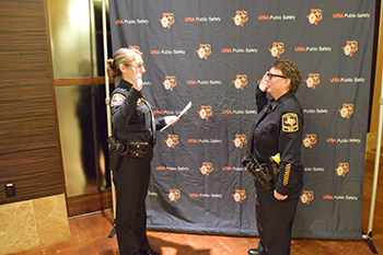 photo of Chief Schoenborn swears in Heather Walleck upon her promotion to lieutenant