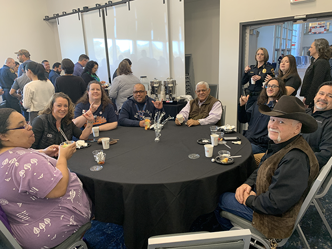 a table of happy UTSA employees