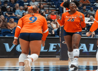 Volleyball players playing.
