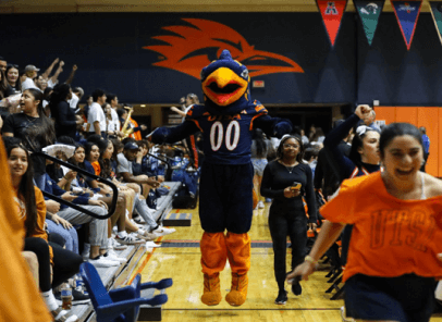 Rowdy Roadrunner cheering at a Volleyball game.