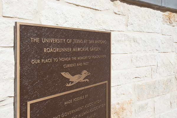 Close up of the UTSA plaque in the memorial garden