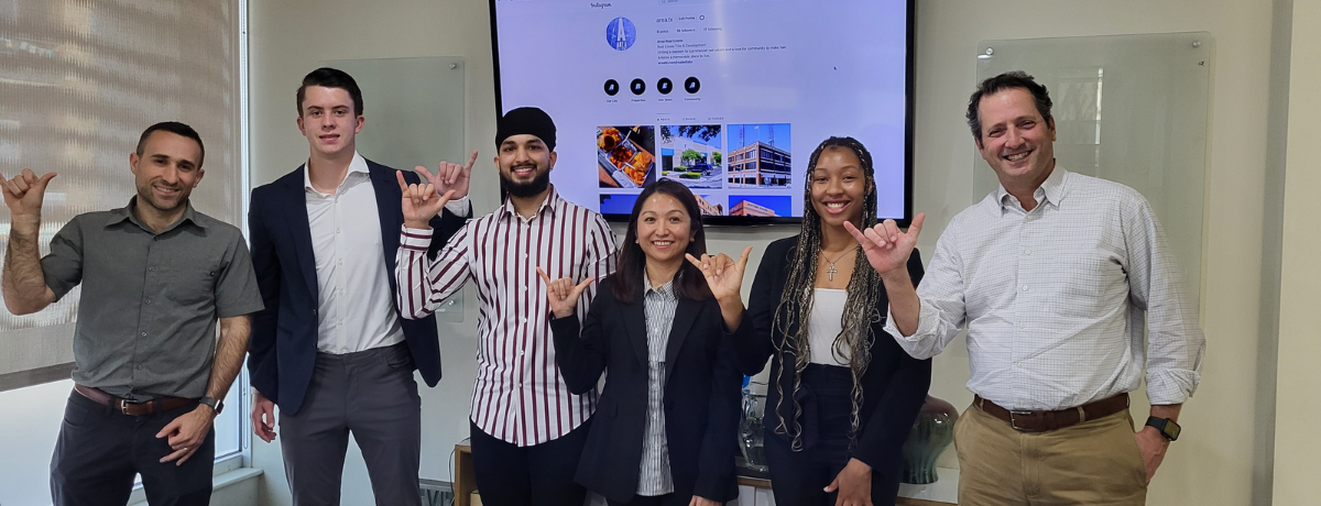 A picture of 5 attendees of the Battle of the brains